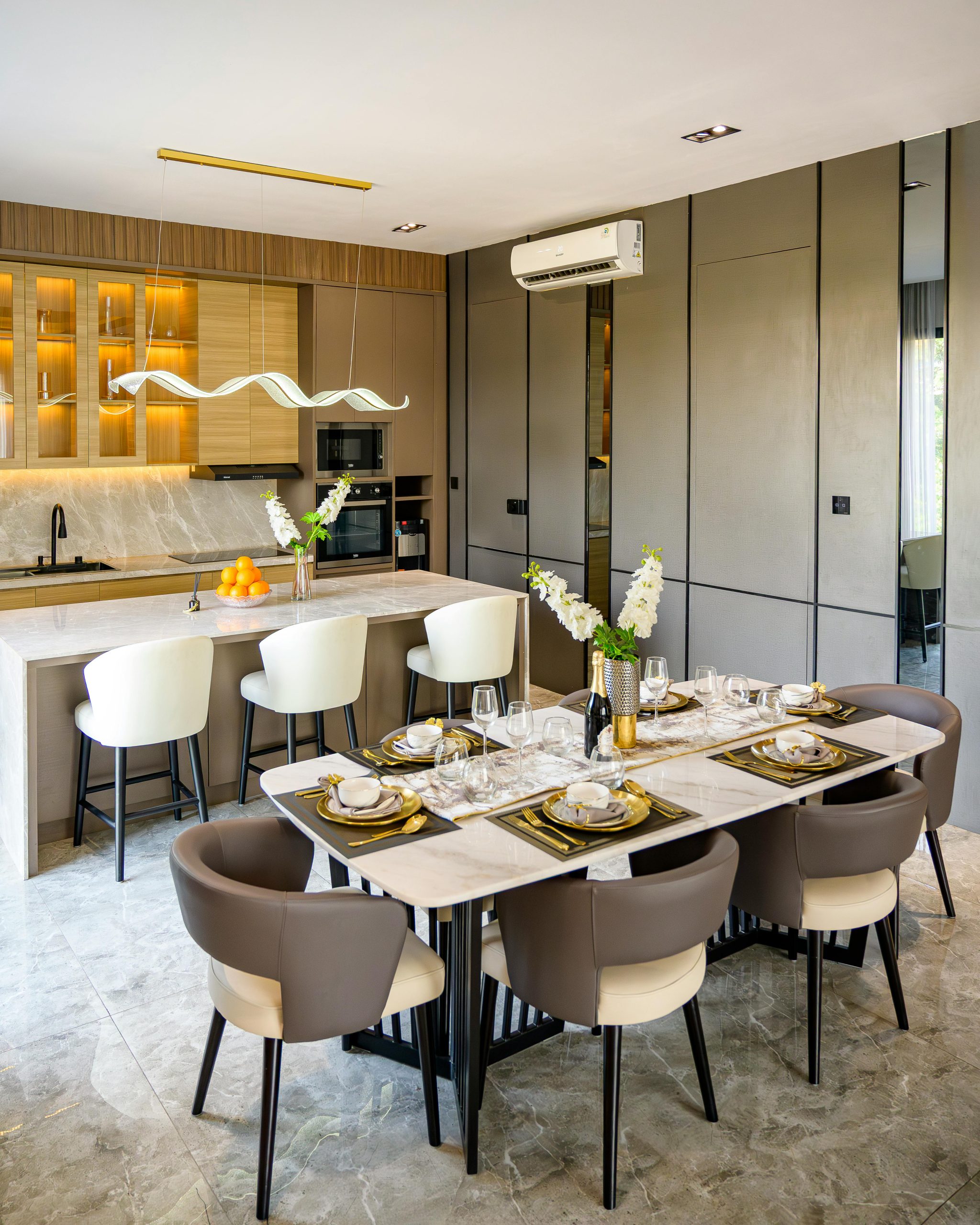 Home Chic and contemporary dining and kitchen area with elegant decor in Jakarta apartment.