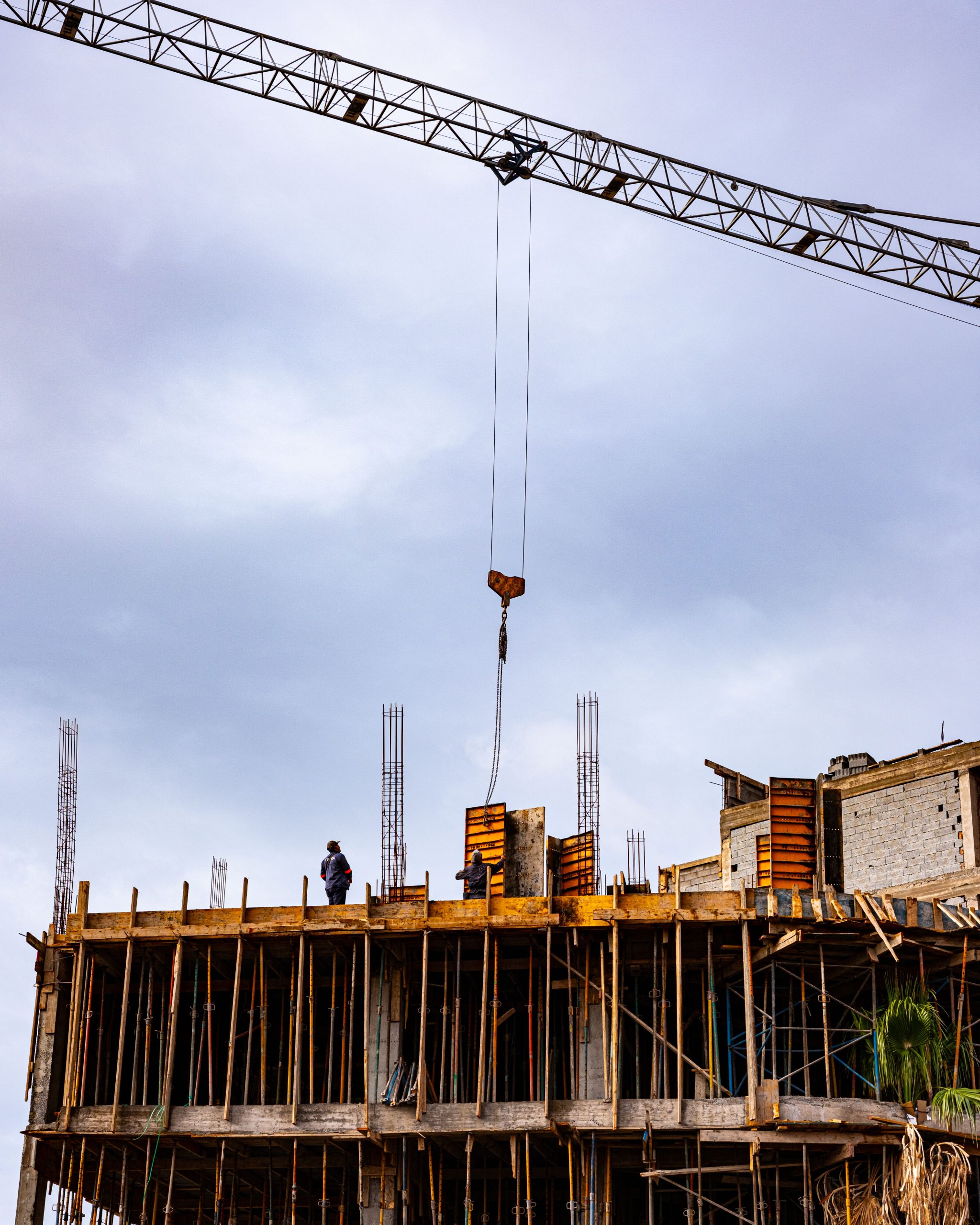 Home Building under construction with crane in Marrakesh, Morocco showcasing urban development.